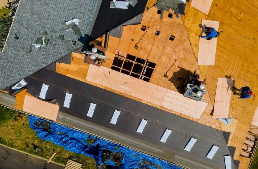 a-roofer-nailing-shingles-with-air-gun-replacing-2023-11-27-05-14-52-utc-crop.jpg